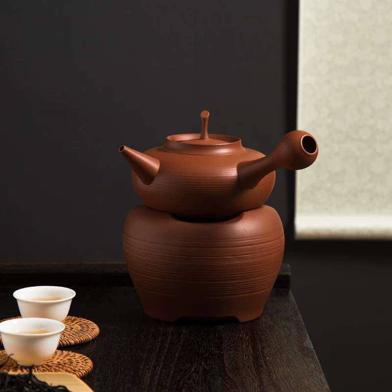 Teapot stacked on clay warmer